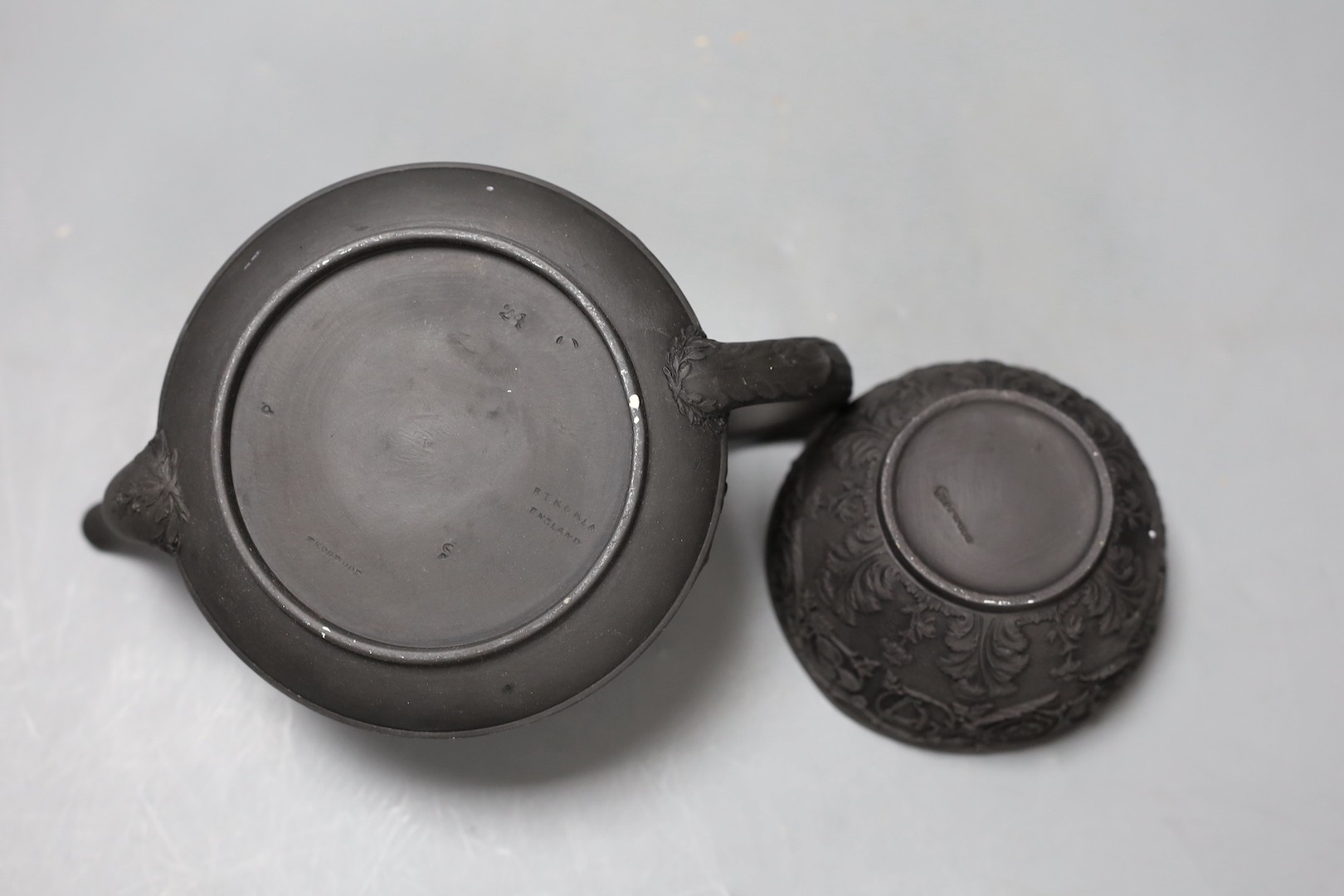 A Wedgwood black basalt 'Union' sugar bowl, early 19th century and a teapot and cover 10cm tall